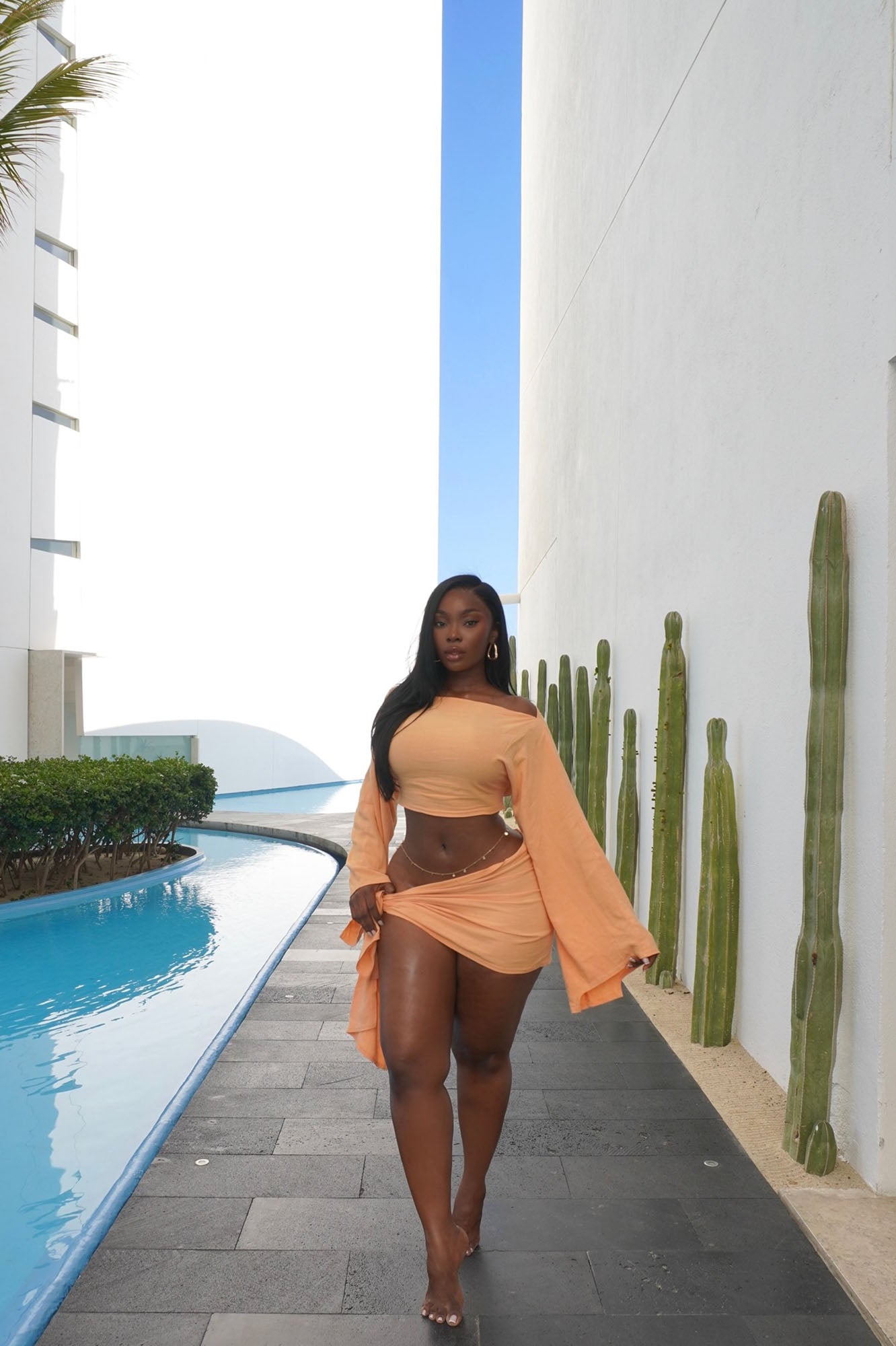 https://cdn.shopify.com/s/files/1/0293/9277/files/4-14-25__290_Summer_Nights_Linen_Skirt_Set_Peach_JR.jpg?v=1748451165